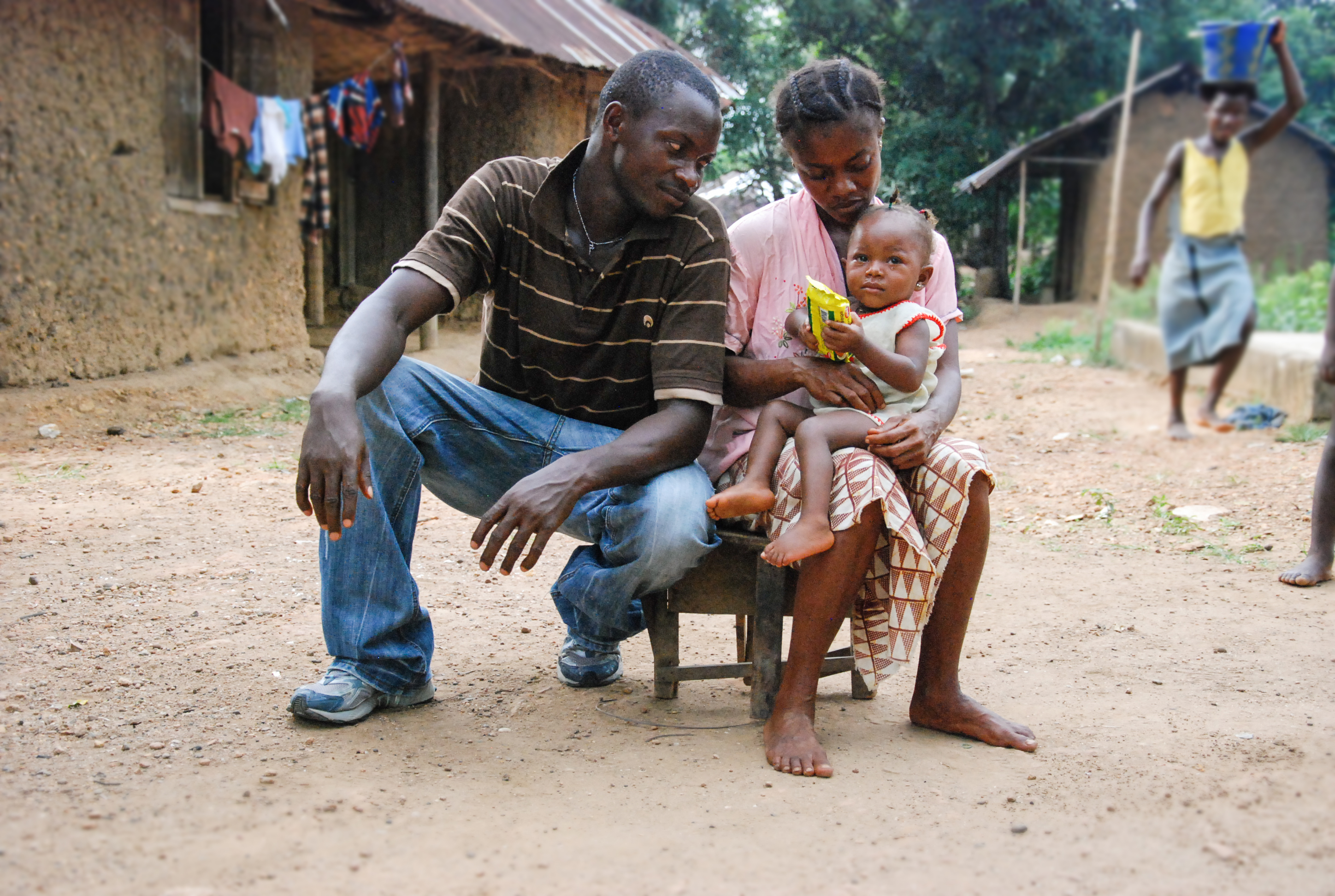 Father, mother, and infant girl in Sierra Leone