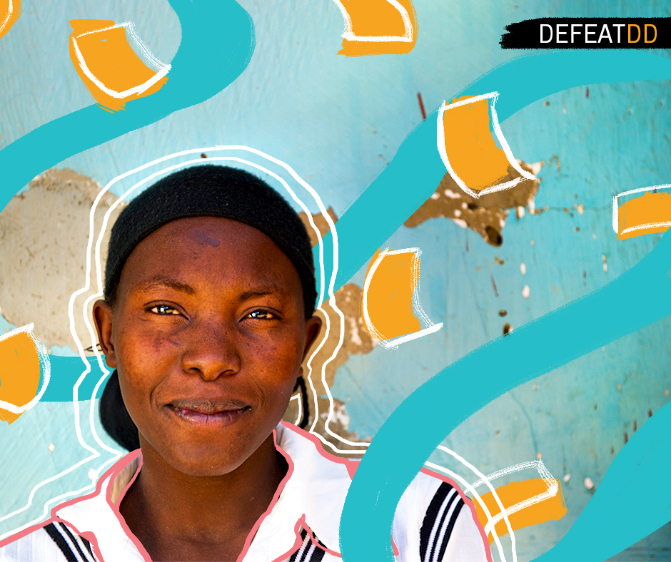 A person with a black headband and a white shirt stands smiling against a backdrop of a blue wall with abstract orange and turquoise designs. The text "DEFEATDD" is positioned in the top-right corner.