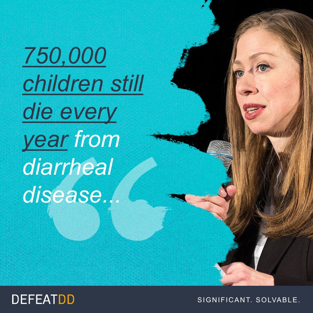 A woman with long hair speaks into a microphone while on stage. The text on the image reads, "750,000 children still die every year from diarrheal disease…" The bottom left corner displays the logo "DefeatDD" and the text "Significant. Solvable.