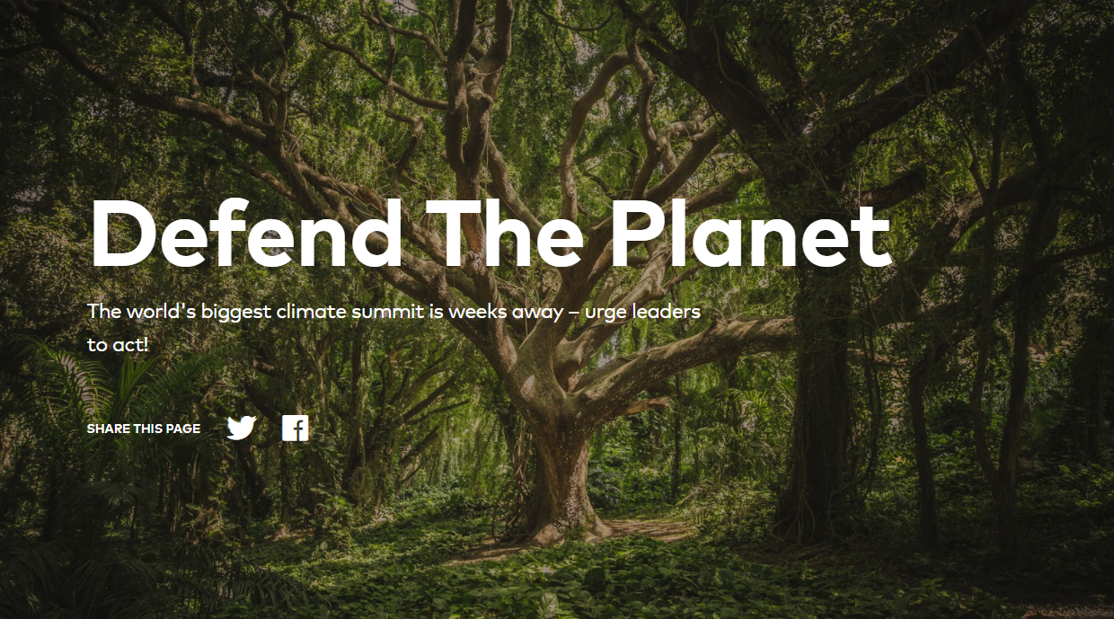 A lush forest scene with large trees and dense foliage. Overlaid text reads, "Defend The Planet - The world's biggest climate summit is weeks away – urge leaders to act!" Social media icons for sharing on Twitter and Facebook are below the text.