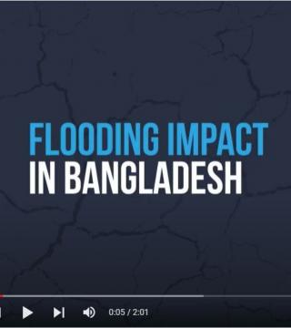 A video player screen shows the title "Flooding Impact in Bangladesh" in blue and white text against a dark background with subtle crack patterns. The video progress bar is at 0:05 of 2:01 total duration, with play and volume controls visible.