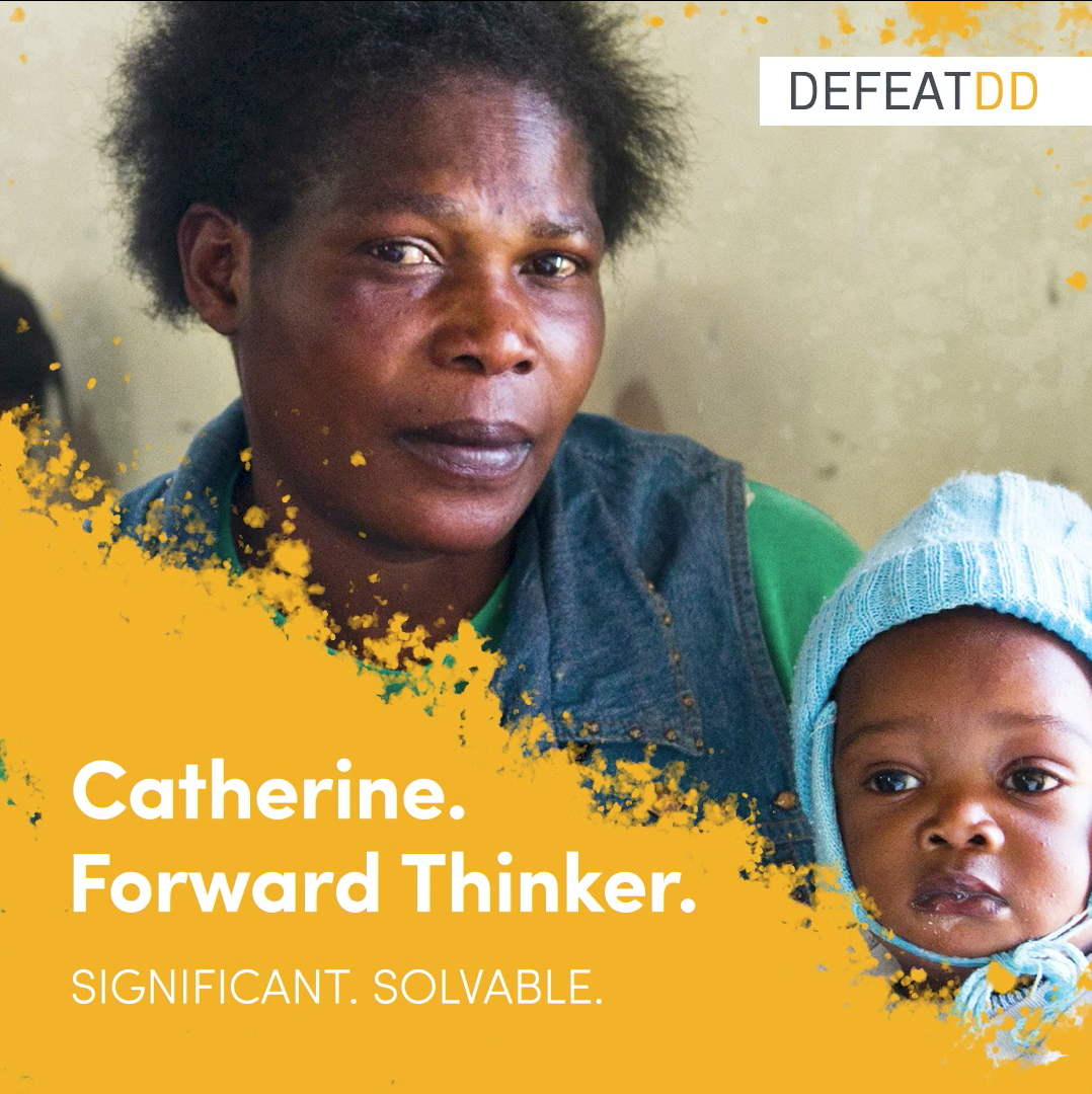 A woman and a baby sit close together. The woman looks directly at the camera. Text reads: "Catherine. Forward Thinker. Significant. Solvable." The background features a splash of yellow paint.